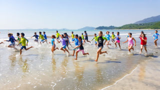 Hong Kong green school Lantau International School - students on beach