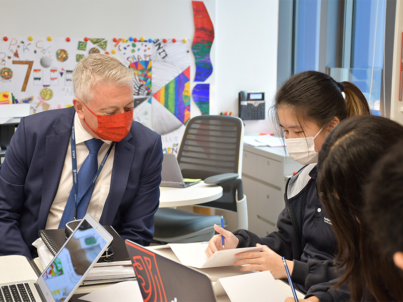 Marco Longmore, Head of School at Stamford HK with students